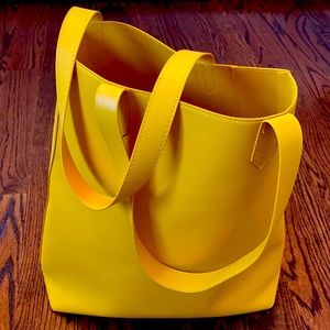 Yellow tall tote with leather like material